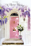 This photograph portrays a new home's entrance in Wimbledon, styled with the kind of understated elegance that makes a doorway feel instantly loved. A pastel pink front door, flawlessly painted and slightly glossy, sits in the centre, framed by whitewashed walls that glow softly in natural daylight. Beside it, a blush-tinted shutter hints at windows just out of view, suggesting cosy rooms within. Above and around the door, wisteria pours down in abundant lavender streams, its pendulous clusters forming soft, irregular curtains of flower. The individual blossoms are small and delicate, but together they create billowing swathes of colour, reminiscent of spring evenings near Wimbledon Village when the air is filled with floral scent.
At the doorstep stands a simple yet stylish grey metal bucket, placed with care on the stone step. It is overflowing with white and cream roses, each bloom perfected to a stage where the petals are thick, satiny, and gently unfurling. Some roses cup inward protectively, while others open outwards to catch the light, revealing their layered hearts. Interspersed among them is fresh green foliage, its softer, rounded leaves and occasional sprigs of texture giving the bouquet movement and a natural rhythm. Around the base of the bucket, a pink ribbon is wrapped and finished in a neat, flowing bow, its colour echoing the door and harmonising the entire palette. The daylight is gentle, free of harsh shadows, so that the colours appear pastel and peaceful. Overall, the scene feels like a personal blessing at the threshold: a floral arrangement you might find waiting outside a new front door in SW19, delivered by a caring local florist to mark the joyful, slightly nerve-tinged moment of stepping into a new chapter of life.